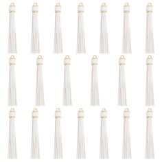 twelve white tassels with gold accents on each side and one in the middle