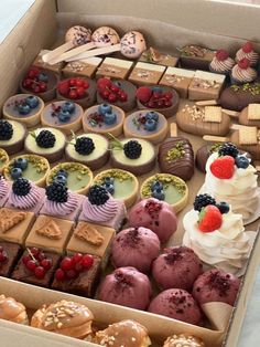 a box filled with lots of different types of desserts