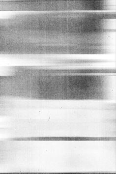 black and white photograph of an airplane in the air with blurry lines on it