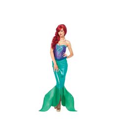 a woman in a mermaid costume is posing for the camera with her hands on her hips