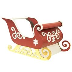 a wooden toy sleigh with snowflakes on it