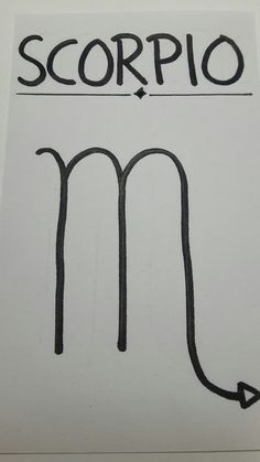 the scorpio symbol is drawn on a piece of paper