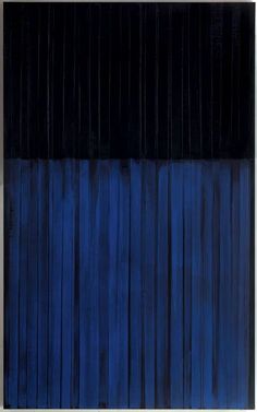 an abstract painting with blue and black stripes on the wall in front of a window