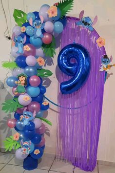 the balloon column is decorated with blue and purple balloons