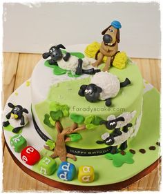 a birthday cake decorated with sheep and numbers