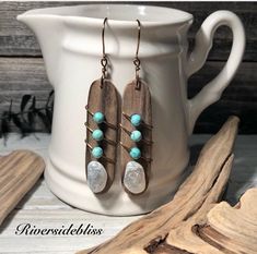 These earrings were created with natural white agates and driftwood , both of which I found on Northern California beaches. Not easy to find good matching pieces! I paired the driftwood and agates to make these one of a kind pair of earrings!  The small turquoise beads are a natural stone called magnesite and I wired them in place with antique brass wire!  The driftwood has been cleaned and coated with sealer for a protective coating!  The agates are in their raw natural ocean tumbled state ! I Northern California Beaches, California Beaches, White Agate, Turquoise Beads, Northern California, Ear Wires, Wire Wrapped, Wire Wrapping, Antique Brass