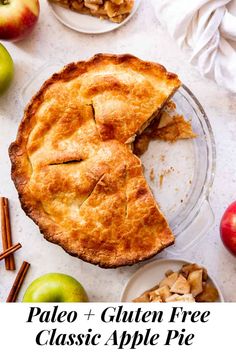 an apple pie with one slice taken out and the rest of the pie in front