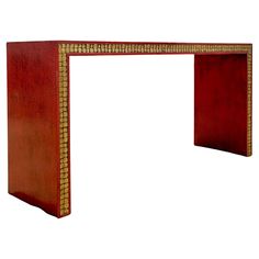 a wooden console table with an intricate design