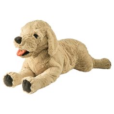 a stuffed dog laying on its side with it's tongue out