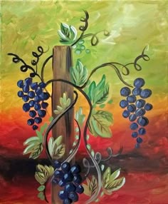 a painting of grapes on a wooden post