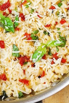 a close up of a plate of food with rice and vegetables on it, ready to be eaten