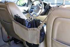 the interior of a car with a purse hanging from it's center console and text overlay that reads, car cache plus a giveaway