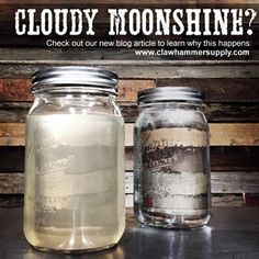 two jars with liquid inside sitting on a table next to each other and the words cloudy moonshine?