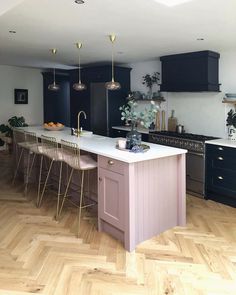 a large kitchen with an island in the middle