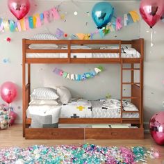 there is a bunk bed with balloons and streamers on the wall in this room