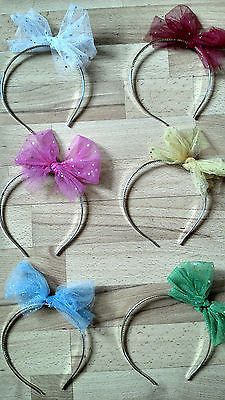 six different colored bows on headbands