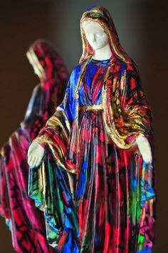 two colorful figurines are standing next to each other