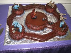 a large chocolate cake on top of a purple table