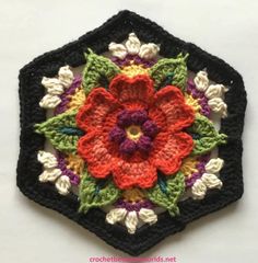 a crocheted flower is shown in the middle of a tweetchet