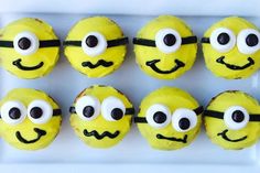 some yellow cupcakes with googly eyes and mustaches