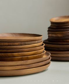 a stack of wooden plates stacked on top of each other