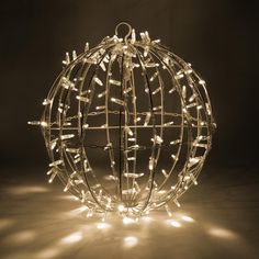 a lighted ball ornament in the shape of a sphere with lights on it