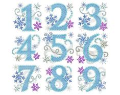 the numbers are made up of snowflakes and sparkles on white paper, with blue