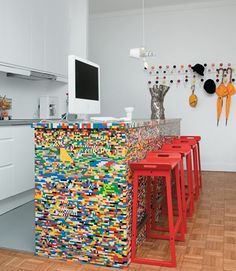 there are many lego stools in this kitchen