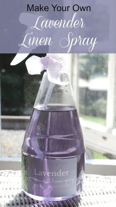 lavender linen spray in a glass bottle on a table with the words how to make your own lavender linen spray