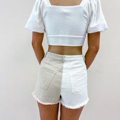 - 100% Cotton - Tan + white color - Model is pictured in a size small - Waist measurements: S - 26", M - 28", L - 30" White Denim Jean Shorts For Summer, White Cotton Jean Shorts For Summer, Trendy White Denim Shorts, Fitted Cotton Jean Shorts Casual Style, White Relaxed Fit Denim Bottoms, Trendy High-waist White Jean Shorts, White Short Denim Jeans, Trendy High Waist White Jean Shorts, White Short Length Summer Jeans