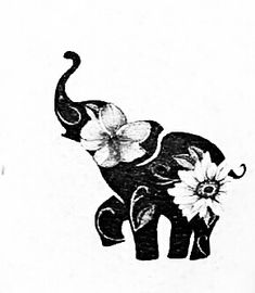 an elephant with flowers painted on it's back