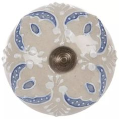 a white and blue door knob with an ornate design