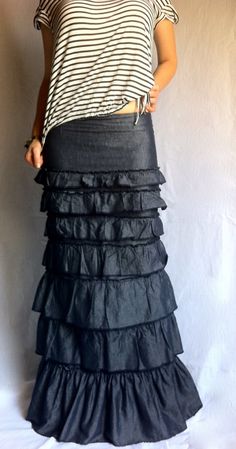 a woman wearing a black skirt with ruffles