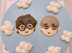 there are two cakes made to look like the faces of people with glasses on them