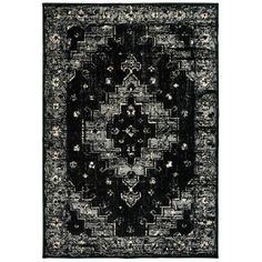 a black and white rug with an intricate design