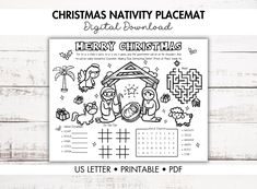 the christmas nativity placemat is shown in black and white, on a wooden background