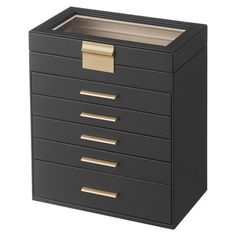 a black drawer with gold handles and drawers on the bottom, in front of a white background