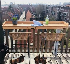 the table and chairs are on the wooden deck