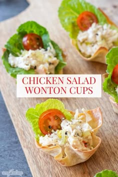 chicken salad wonton cups with lettuce and tomatoes in them on a cutting board