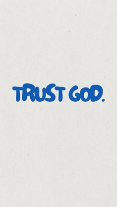 the words trust god written in blue ink