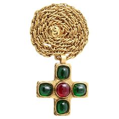 Vintage Chanel Gripoix Glass Cross Necklace, 1982. Green and red glass mounted in gold tone metal; the chain marked 'Chanel 1982' and 'Made in France', the pendant marked 'Chanel Depose' and numbered. This piece is a real fashion statement. The iconic Chanel brand needs no introduction, and it will never go out of style. Chanel Necklaces, Vintage Chanel Jewelry, Chanel Ring, Grand Cross, Glass Cross, Real Fashion, Vintage Designer Jewelry, Chanel Brand, Chanel Necklace