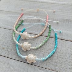 The TURTLE Ombre Beaded Bracelet is a single bracelet consisting of 8/0 Glass Beads in an Ombre design with a Turtle Bead centerpiece.  Currently available in 3 colors: Ombre Green, Ombre Blue, and Ombre Coral.   Wear alone or mix-n-match with other bracelets. Bracelets are made with 0.8mm Nylon Cord, which is waterproof and very long-lasting.   Bracelets are made adjustable from 5.5 inches to 8.5 inches. Ombre Green, Single Bracelet, Crystal Bead Jewelry, Turtle Jewelry, Turtle Bracelet, Ombre Design, Bracelets Design, Ocean Jewelry, Beads Bracelet Design