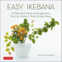 the book cover for easy ikebana is shown with flowers in a white vase