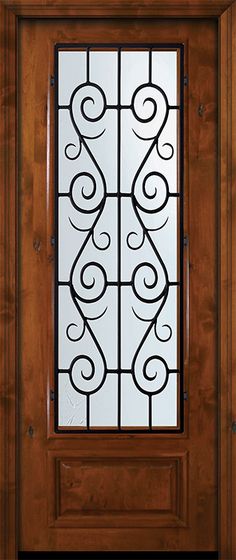 a wooden door with glass and wrought iron design on the top panel, sidelight