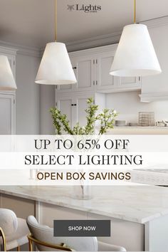 a kitchen with white cabinets and an open box savings sign on the wall above it that says up to 60 % off select lighting