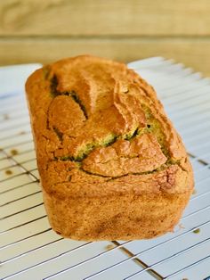 a loaf of bread sitting on top of a cooling rack