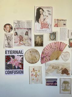 a wall covered in pictures and assorted paper items including a fan, brochures, etc