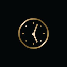 a gold clock on a black background