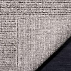 a close up view of the corner of a rug