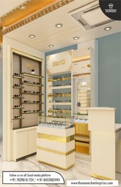 the interior of a store with gold and white accessories in it's display cases